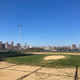White Ford Field with the East River and Manhattan in the background.